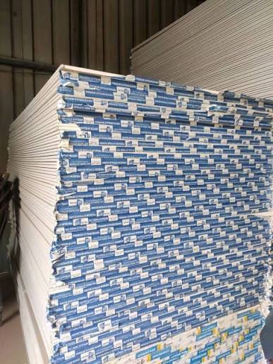 Gypsum boards stacked in bulk at warehouse